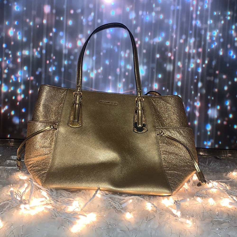 Gold shimmering Michael Kors women’s purse. Smoke free home. Pet free home.